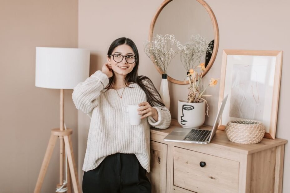 Woman enjoying a bright, cozy morning with coffee and a lamp