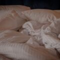 Soft, smooth silky pillows and bedding on a bed