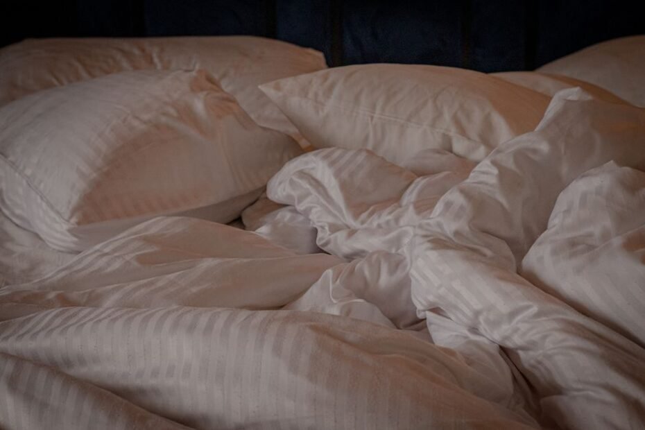 Soft, smooth silky pillows and bedding on a bed