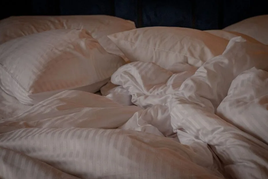 Soft, smooth silky pillows and bedding on a bed