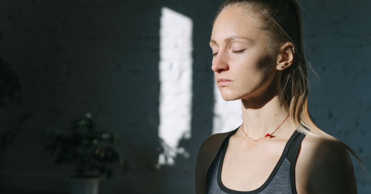 Woman breathing calmly with eyes closed