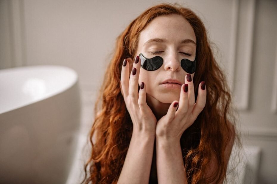 Woman relaxing with a cooling eye mask to soothe puffy, tired eyes
