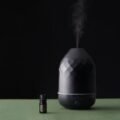 Essential oil diffuser releasing calming mist in spa setting