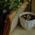 Warm cup of herbal tea with dried herbs for relaxation
