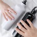 Insulated reusable water bottles held in hands