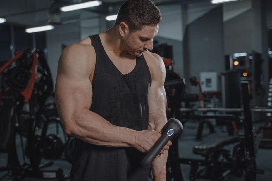 Massage gun used for muscle relief and post-workout recovery