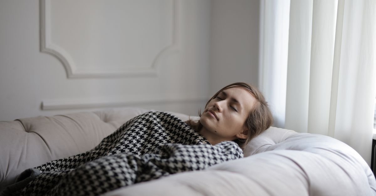 A person resting peacefully in bed