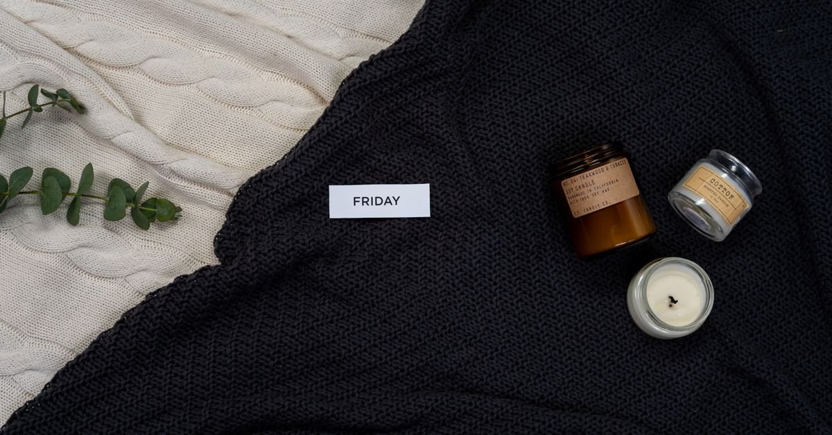 Cosy knitted blanket with a candle for a calm self-care setting