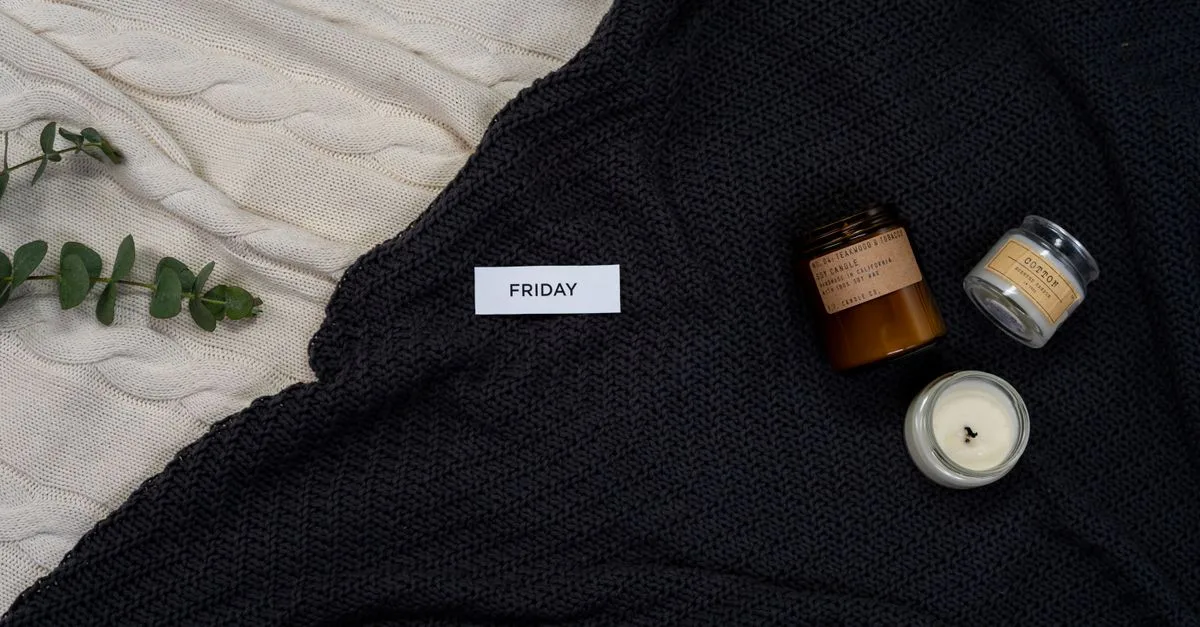Cosy knitted blanket with a candle for a calm self-care setting