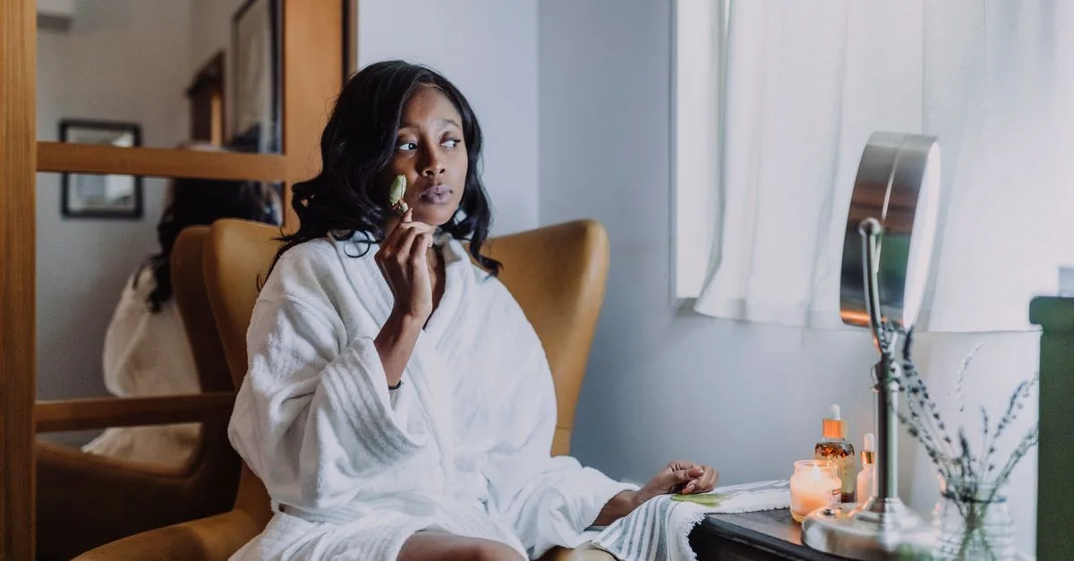 Woman in a robe taking a quiet, relaxed self-care moment