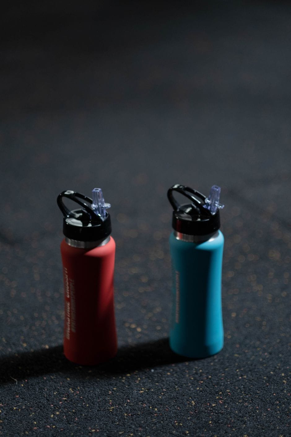 Two straw-lid insulated sports water bottles