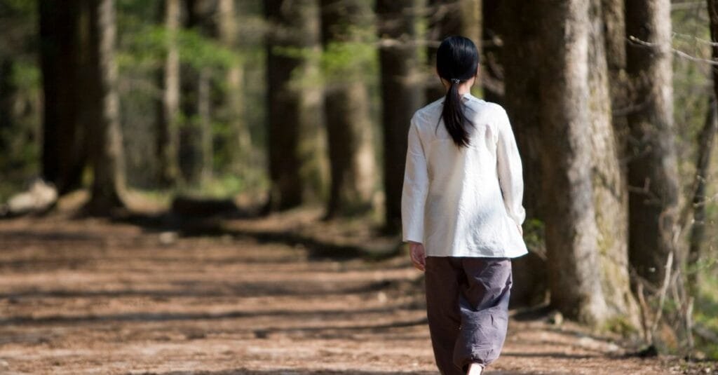 Walking barefoot on a forest path