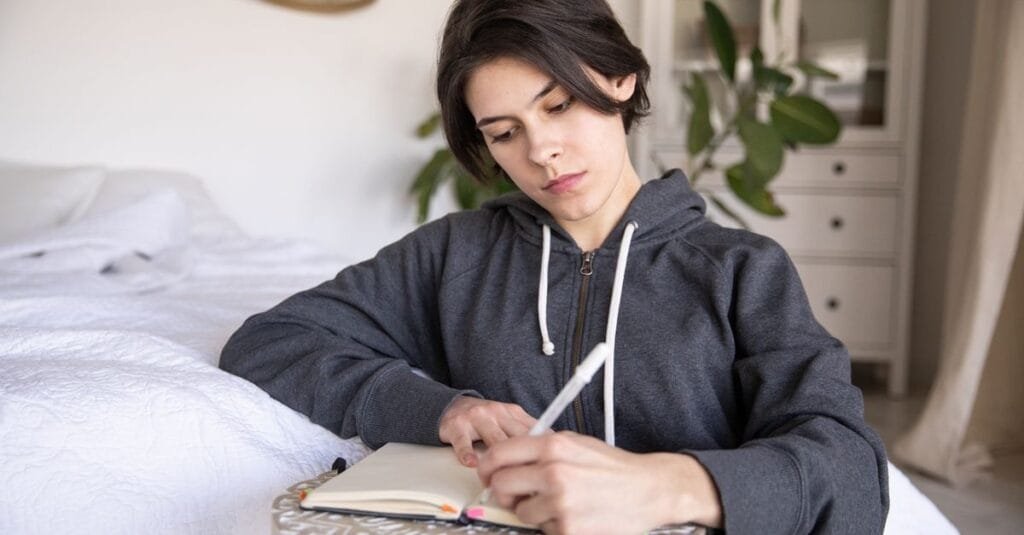 Woman journaling her emotions