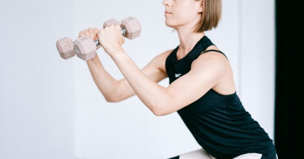 Woman doing a quick dumbbell exercise
