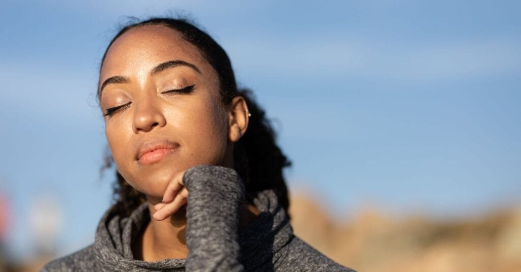 Person breathing calmly in sunlight