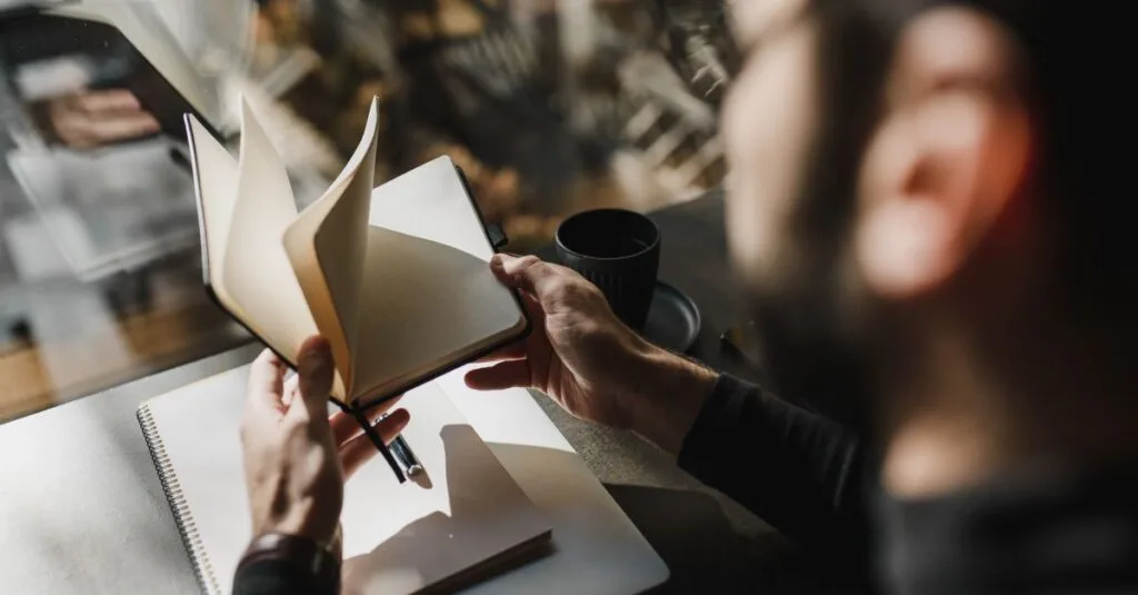 Reflecting with a notebook by the window