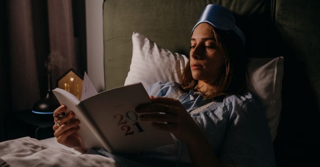 Reading in bed with a sleep mask
