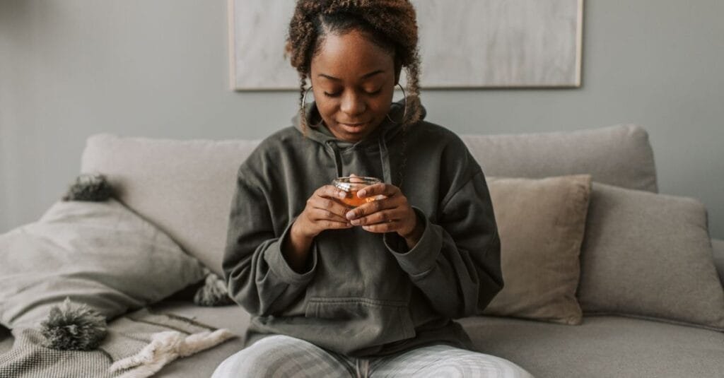 Woman relaxing on the sofa with tea