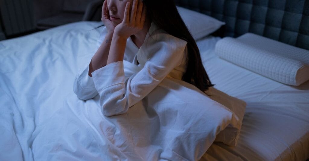 A woman lying awake at night