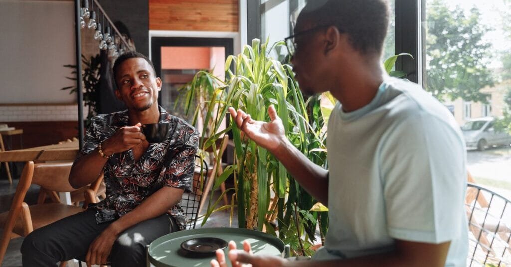 Two friends talking over coffee